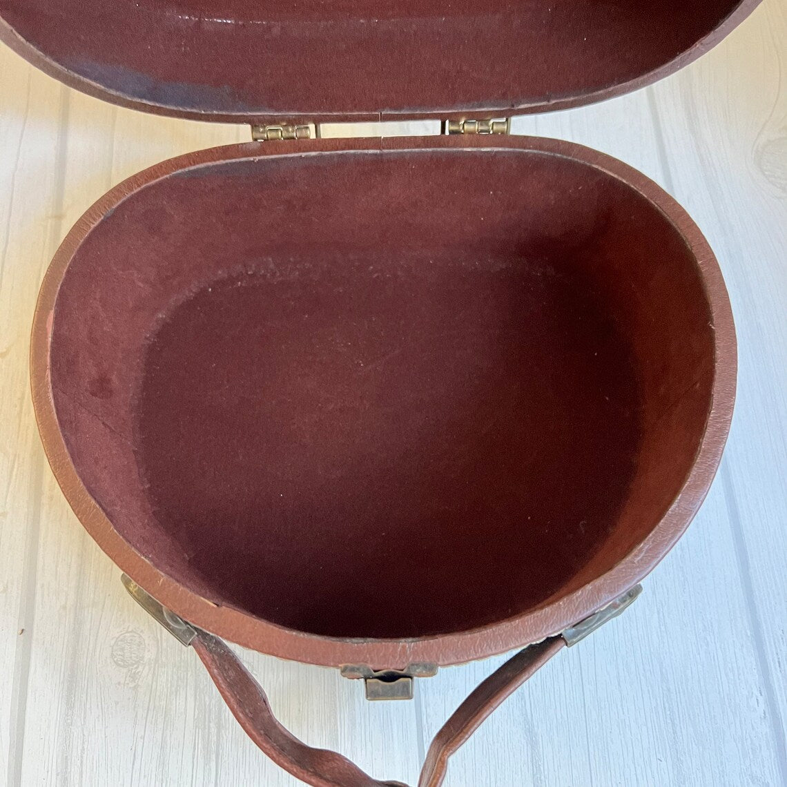 Rich Warm Brown Compact Oval Vintage Carry Case With Concentric Contrast Stitching, Antique Metal Latch Hardware And Single Curved Front Hand Grip
