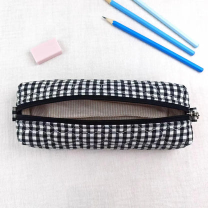 Black White Grid Print Elongated Cylindrical Quilted Stationery Pouch With Heart Stitch Detailing And Full Width Top Slide Zipper Closure