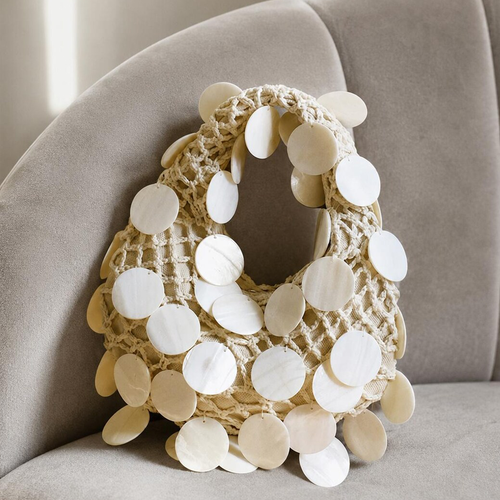 Soft Ivory Open Crochet Curved Hobo Handbag With Scattered Glossy Circular Shell Disc Embellishments And Integrated Loop Carry Handle