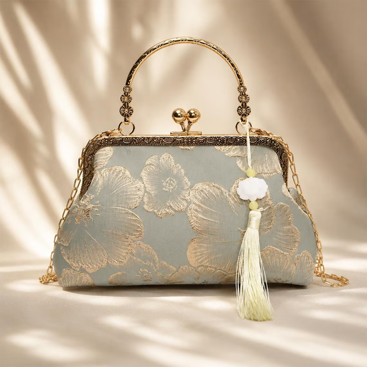 Soft Sage Grey Floral Embossed Kiss-Lock Frame Handbag With Carved Metal Top Handle, Cloud Stone Tassel Pendant And Detachable Metal Carry Chain