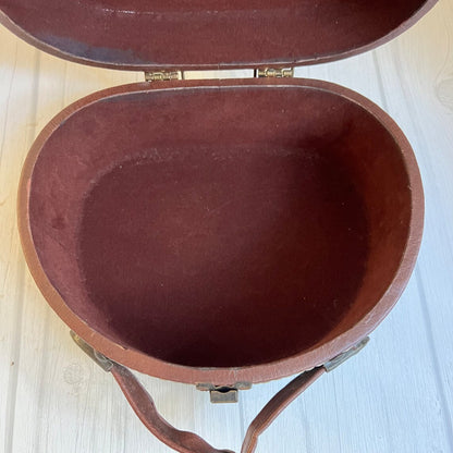 Rich Warm Brown Compact Oval Vintage Carry Case With Concentric Contrast Stitching, Antique Metal Latch Hardware And Single Curved Front Hand Grip