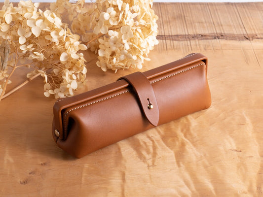 Warm Cognac Brown Rounded Barrel Stationery Holder With Contrast Edge Stitching, Wrap-Around Brass Snap Tab And Vintage Doctor Bag Silhouette