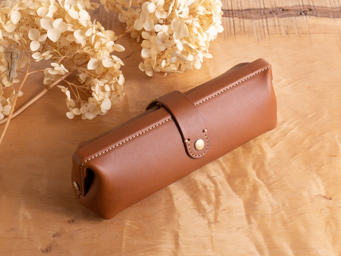 Warm Cognac Brown Rounded Barrel Stationery Holder With Contrast Edge Stitching, Wrap-Around Brass Snap Tab And Vintage Doctor Bag Silhouette